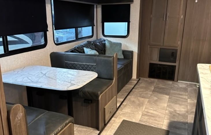 Collapsible table for more sleeping areas, along with a fold out sofa.