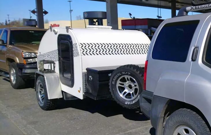 The camper is ready, fueling up, and heading out soon.