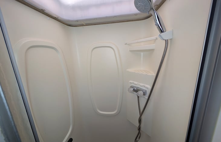 Split bathroom with a separate shower and toilet maximizes comfort.