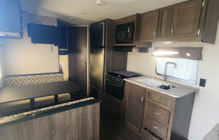 Dinning room with Kitchen, bunk bed at the back with bathroom