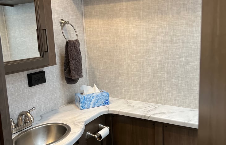 bathroom sink and overhead storage
