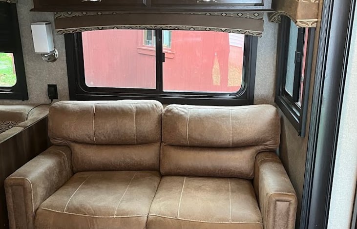 Couch folds out to be a large twin/small full size bed