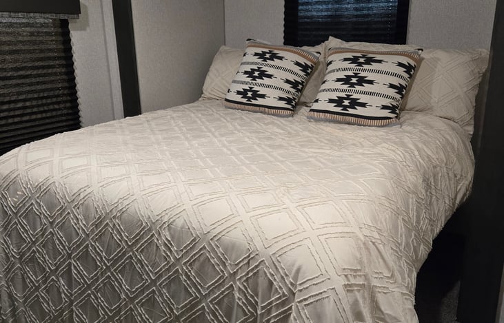 Upgraded queen mattress with luxury linens.
