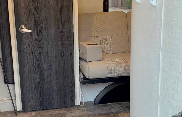 Rear kitchen w/ Jacknife sofa and large pantry. Space available underneath sofa for small storage bins