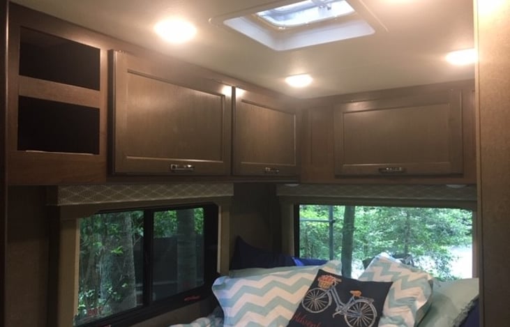 Loads of storage above bed and windows on both sides for cross ventilation