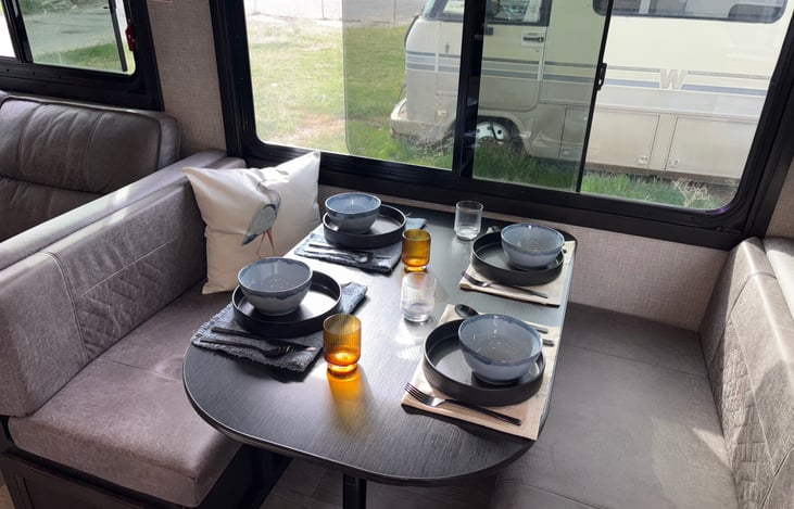 Convertible dinette. 8 piece cutlery, plates, bowls, and glass ware provided.