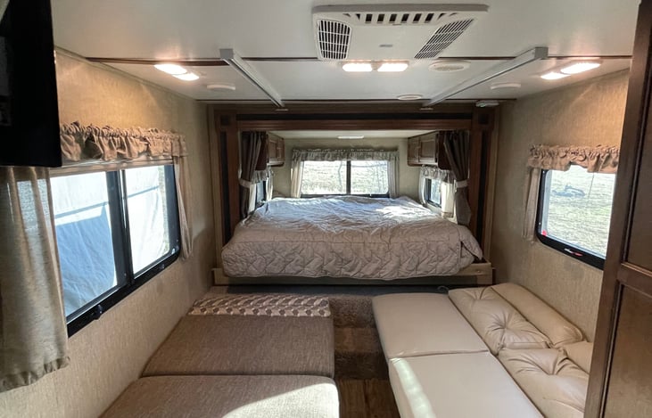 The table and couch transformed into beds, queen bed extended.