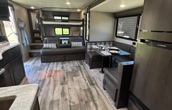 Well thought out layout, you can watch TV from the dinette, the couch or the bunkbeds.
