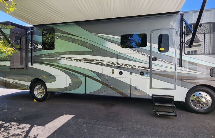 Retractable awning over entertainment area, outdoor TV and audio equipment