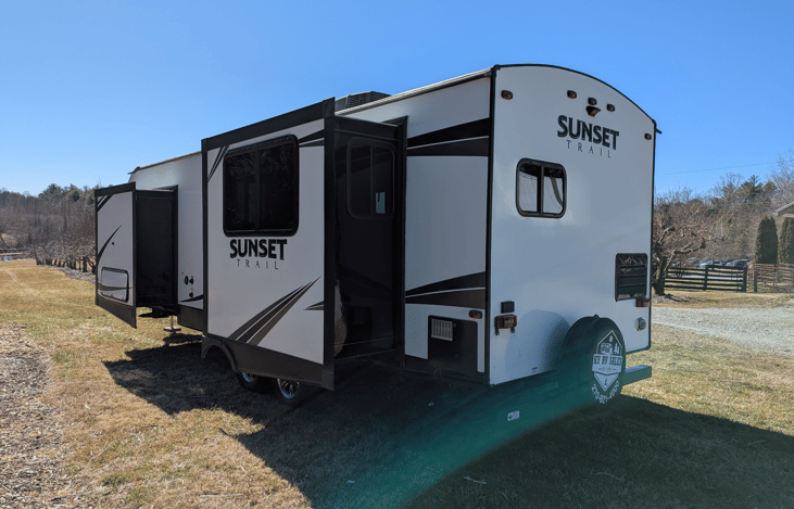 Luxury 30' triple-slide trailer with a gourmet rear kitchen & private master suite. Massive open-concept living and theater seating—the ultimate upscale home on wheels for your next getaway!