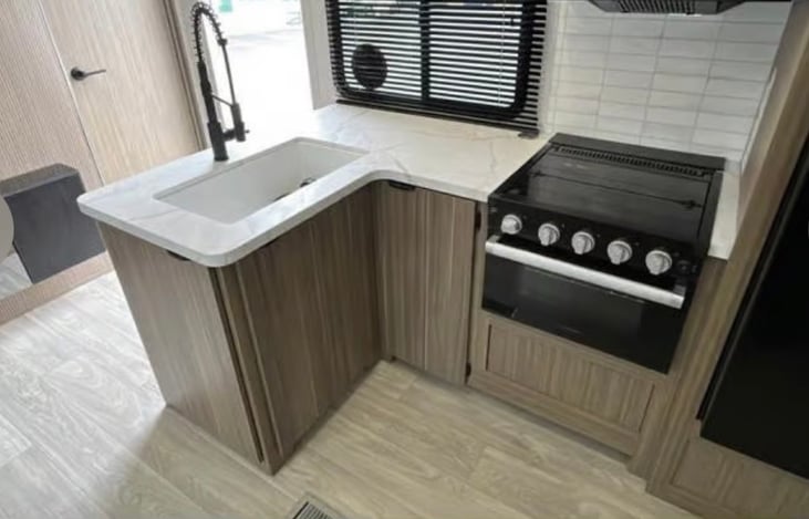 Full sink with stove and microwave