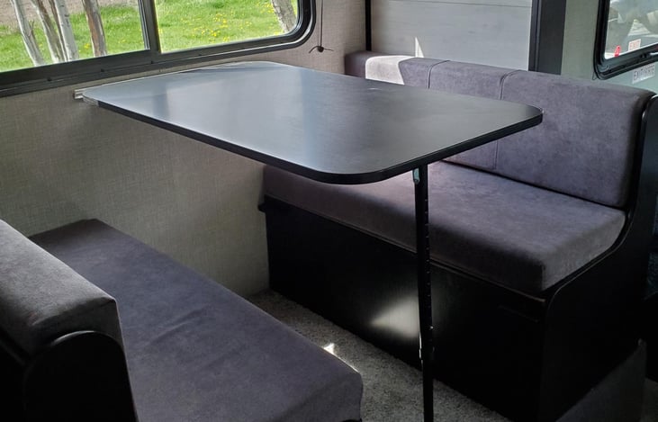 Dining Table in the Pop Out converts to comfy single sleeping