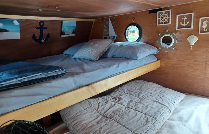 View off the end of the queen size bed and the head of the full-sized bed.