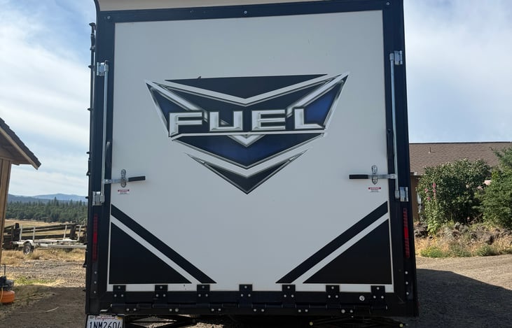 Rear of trailer.  Door drops down and has a screen for more outdoor experience