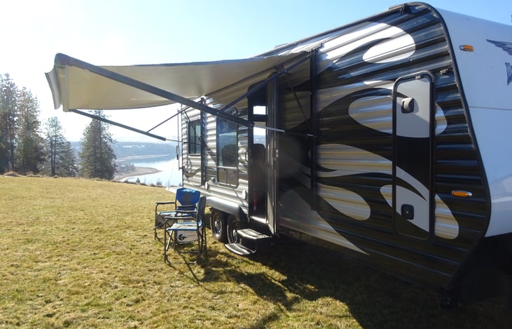 Electric awning extended for protected outside camping
