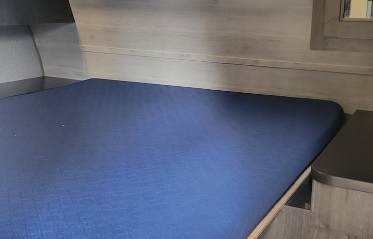 master bedroom with Queen sized bed and sits for privacy.