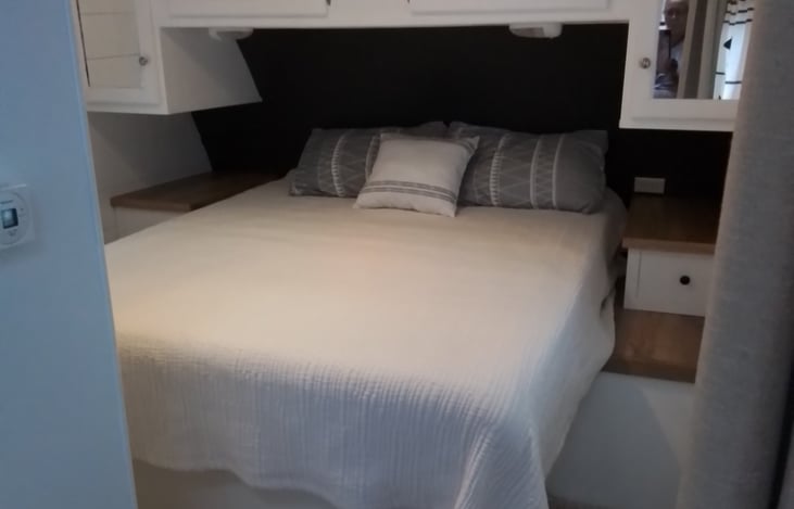 queen bed with surronding storage