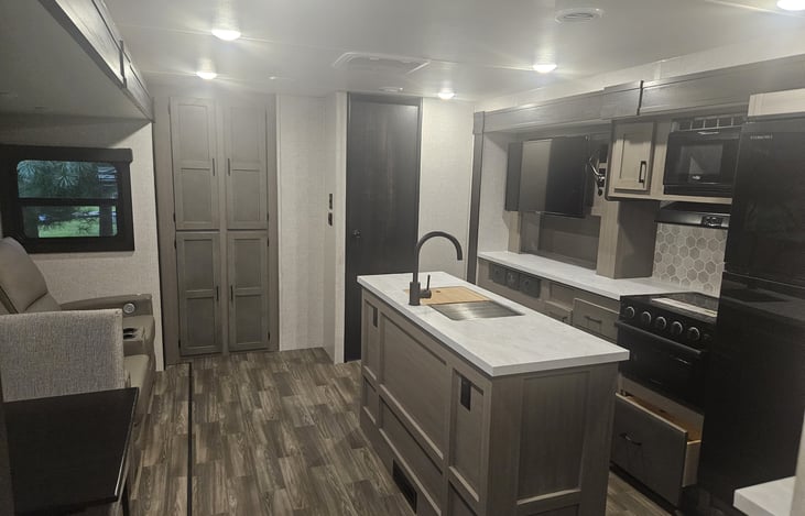 Room to move in this large kitchen with an island, 2 heated recliners with charging ports and built in massage. Smart TV and fireplace.