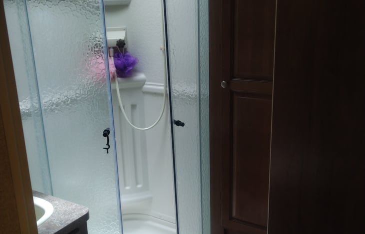 full size shower with hot/cold water available. added skylight for additional head room for the taller folk