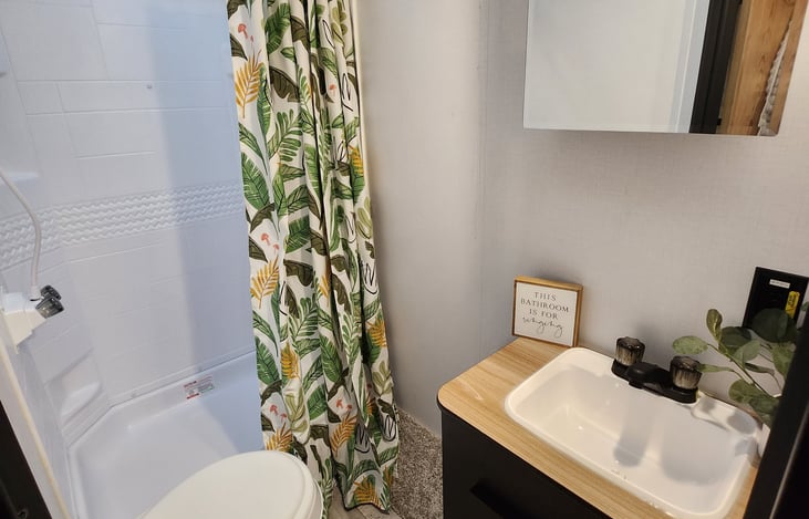 Large shower with built-in storage.