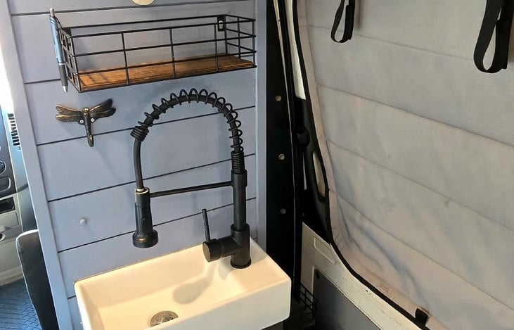 Bathroom / kitchen sink provides regular and hot water from the 40 gallon tank located under the bed.