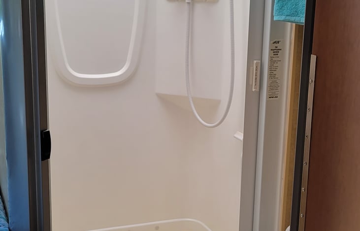 Nice size shower, with soap, shampoo and conditioner dispenser