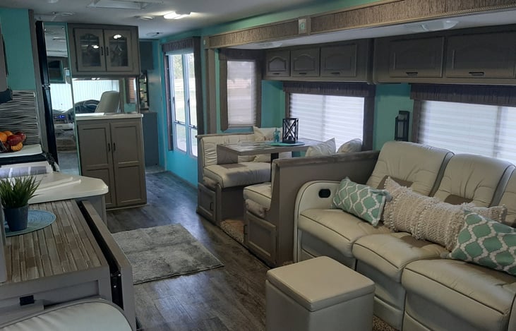 We love our remodeled home on wheels! There is a dinette with custom upholstery that folds down to a bed, the custom leather couch has 2 recliners perfect for kicking back and enjoying your favorite shows