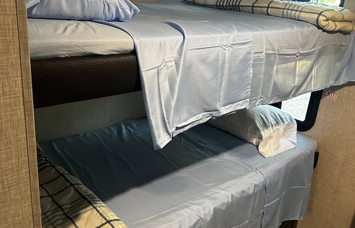 Two of the four bunks. Fresh linen included with every rental