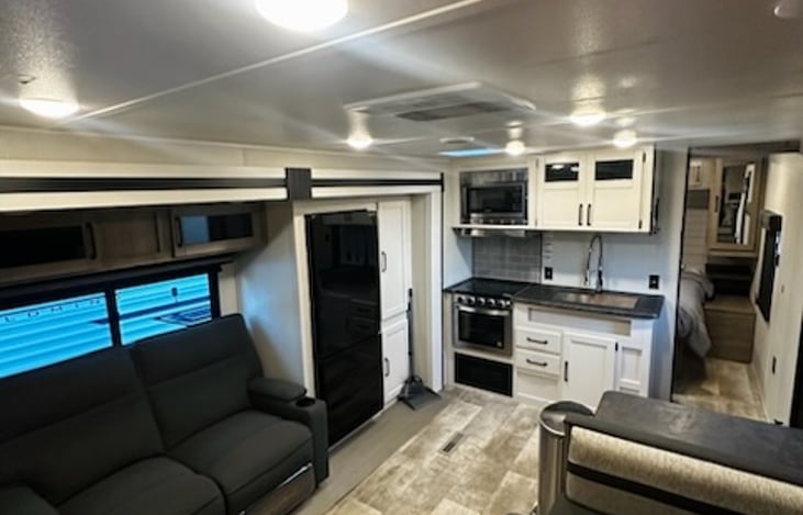 Main Living Space, Private Queen size bedroom (to the right of sink)