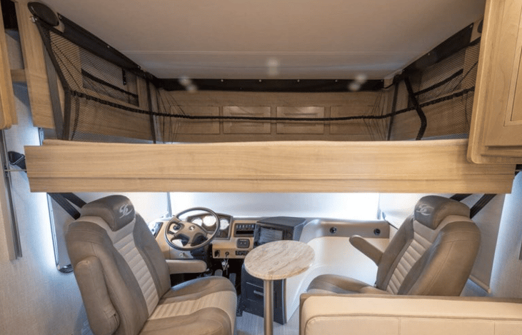 Queen size bunk over drivers seats (only to be used while parked)