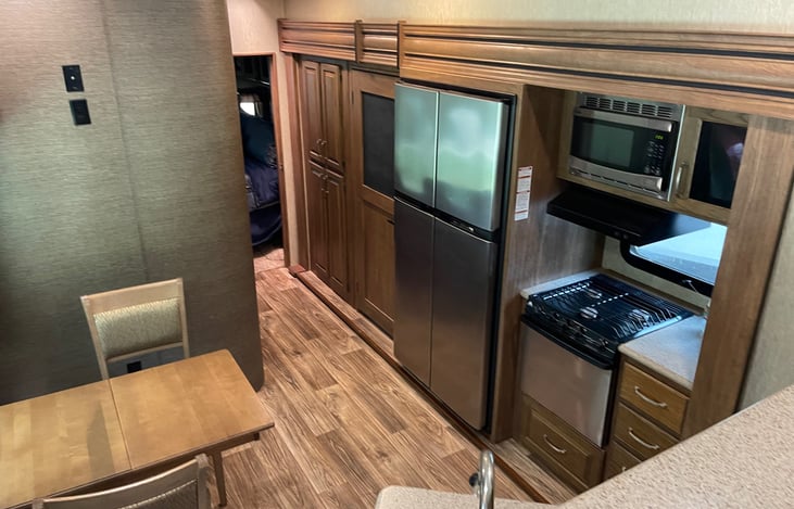 Lookin from the front living room back toward the hallway to bathroom on left and master in the back.