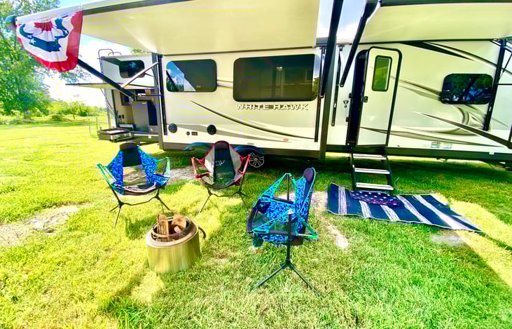 front view with complimentary solo stove use during rental of travel trailer