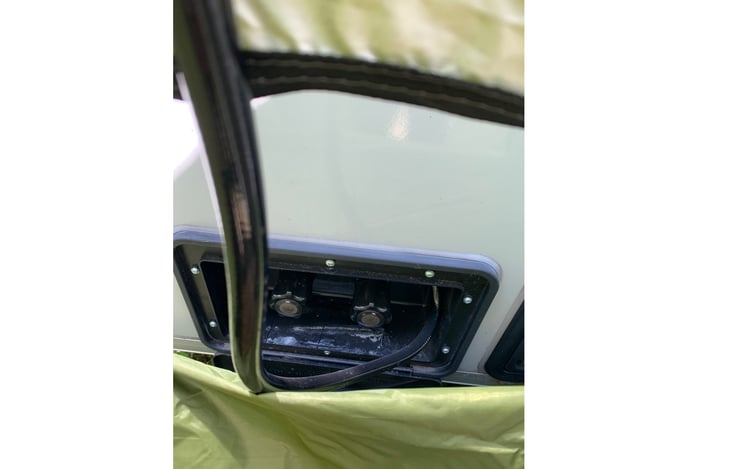 Shower faucet access from tent opening