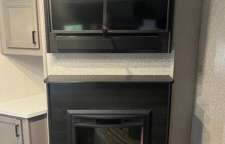 Common area with TV and electric fireplace