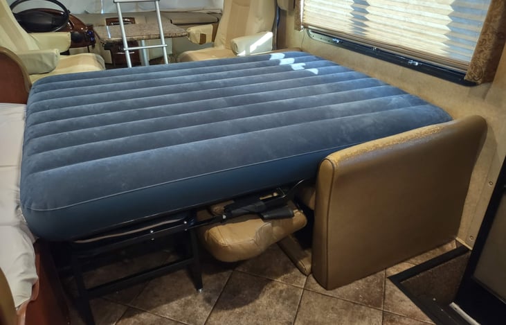 queen air mattress on converted fold-out sofa