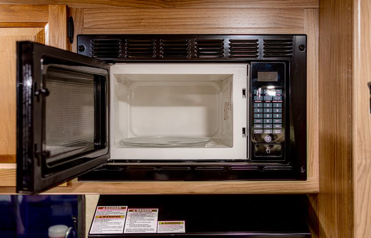 Built-in microwave above the stove for quick meals