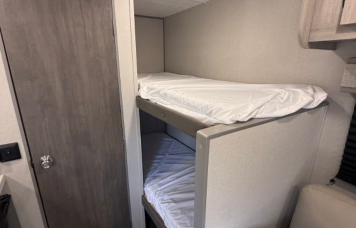 Bunks are great for kids and adults as well.   There is open storage under the bottom bunk