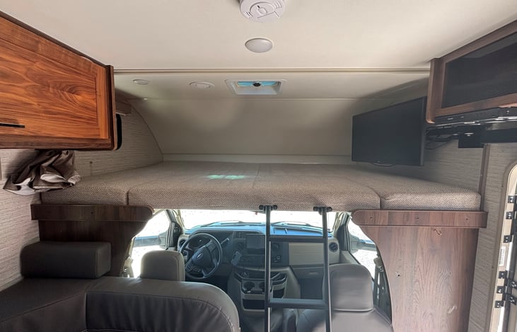 Cab over, sleeps 2. Removable steps. With TV.