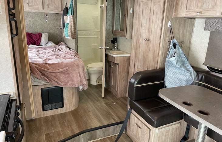 View from living room looking into bathroom and master bed.