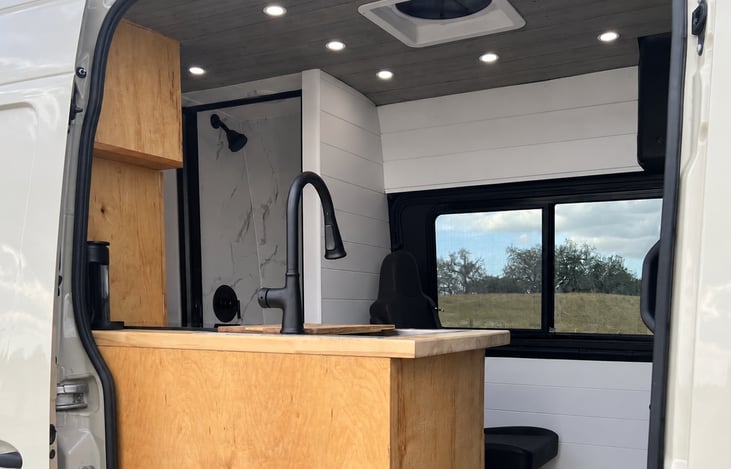 Step inside your home on the road! A bright, thoughtfully designed interior with warm wood finishes, a full kitchen and everything you need to travel comfortably.