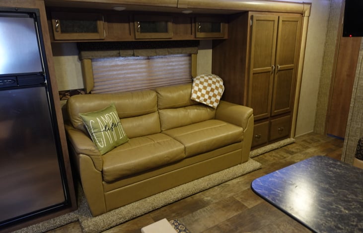 Couch can fold down to be a bed and has storage underneath