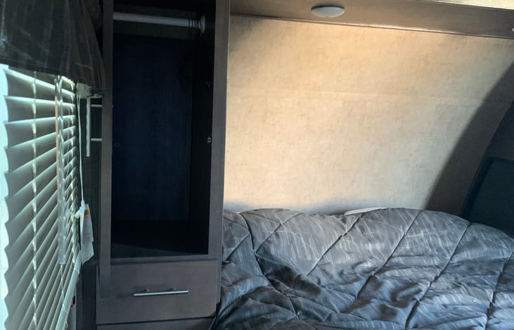 Queen bedroom area with lots of storage