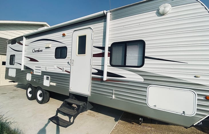 Main entrance camper view with awning above the door area.