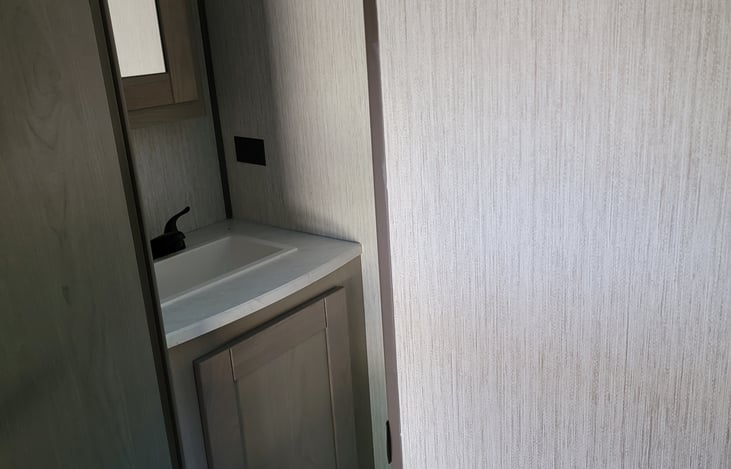 private half bath in bunk house, toilet (opposite of sink) not pictured