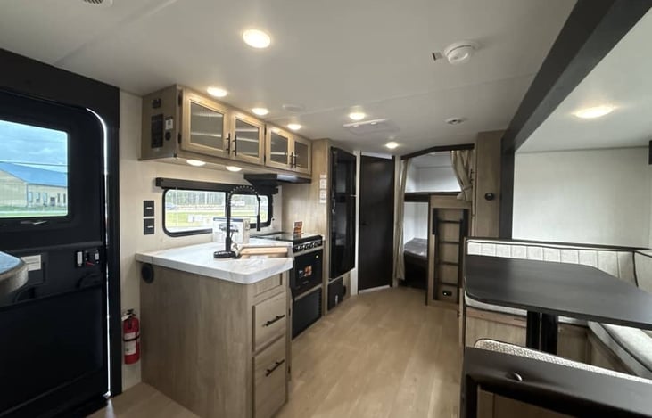 Double Bunks in Rear with Ladder and Privacy Curtains