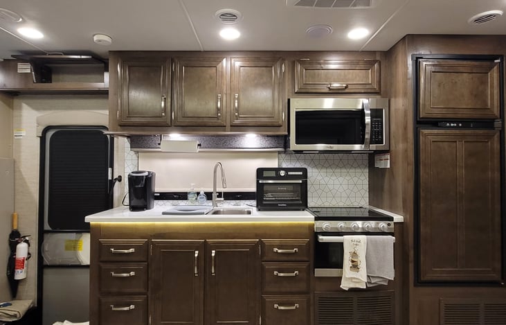 Single KCup Coffee maker, Microwave over the stove, Air-Fryer and sink