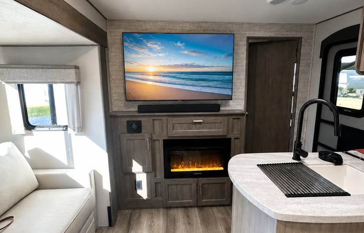 Spacious living area with cozy fireplace
