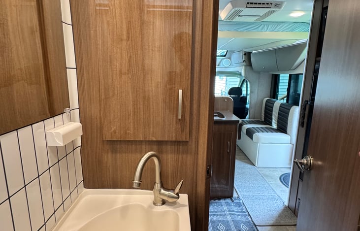 More storage in the bathroom with a medicine cabinet. The sink is deep. Toothbrush holder included, as well as wall mounted body wash, shampoo and conditioner in the shower.