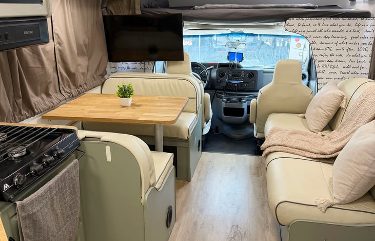 Spacious Class C RV interior with kitchen & living space – Las Vegas RV rental for EDC, Burning Man & camping