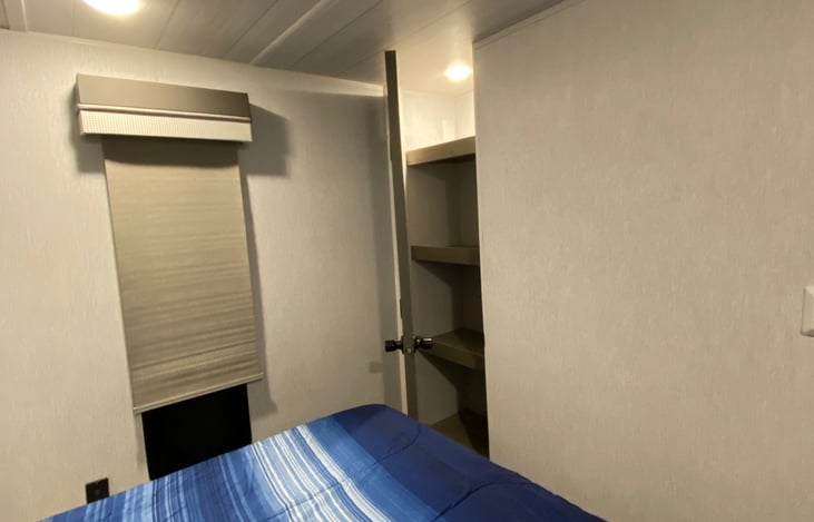 Closet with shelves in bedroom